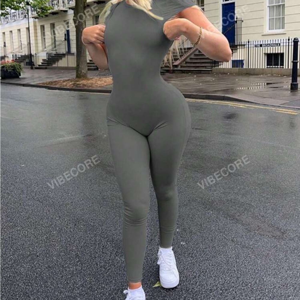 Gray Form-Fitting Jumpsuit with High Neckline